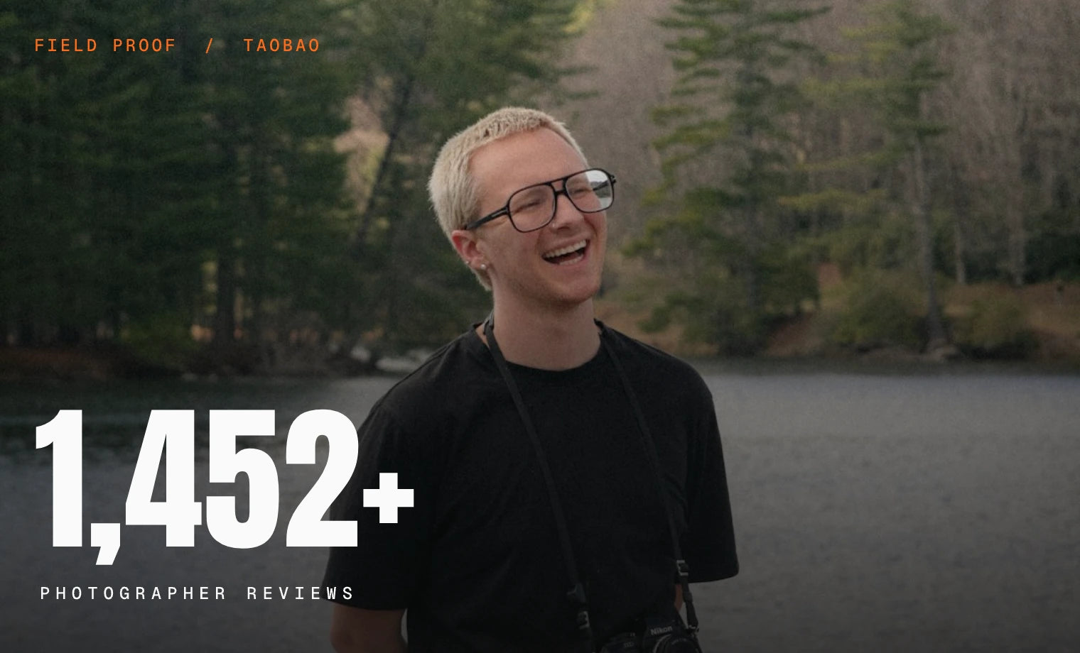 Photographer smiling beside an alpine lake